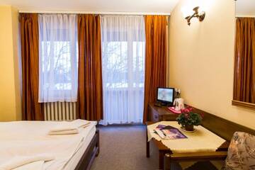 Фото номера Двухместный номер Делюкс с 1 кроватью Отель Hotel PRL RZEMIEŚLNIK г. Закопане 8
