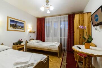 Фото номера Двухместный номер с 2 отдельными кроватями Отель Hotel PRL RZEMIEŚLNIK г. Закопане 5