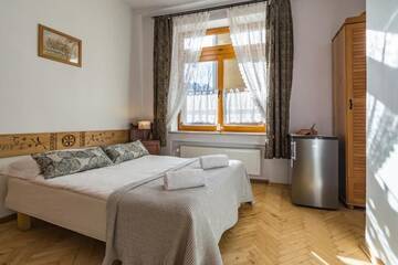 Фото номера Двухместный номер с 1 кроватью Апартаменты Pokoje i Apartamenty Krupówki 36 г. Закопане 18