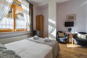 Фото номера Двухместный номер с 1 кроватью Апартаменты Pokoje i Apartamenty Krupówki 36 г. Закопане 9