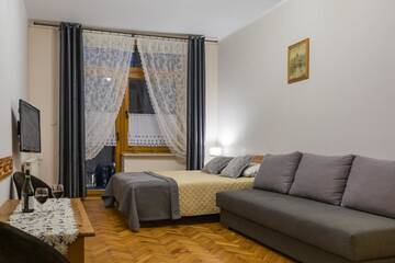 Фото номера Трехместный номер Апартаменты Pokoje i Apartamenty Krupówki 36 г. Закопане 7