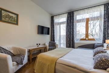 Фото номера Трехместный номер Апартаменты Pokoje i Apartamenty Krupówki 36 г. Закопане 23