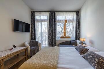 Фото номера Трехместный номер Апартаменты Pokoje i Apartamenty Krupówki 36 г. Закопане 25
