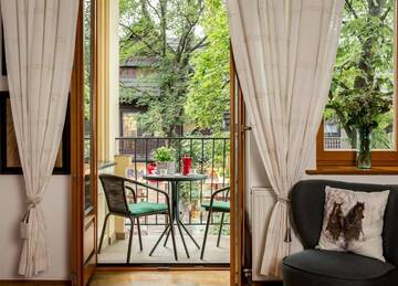 Фото номера Апартаменты с балконом Апартаменты Apartamenty Tatra Club Centrum г. Закопане 21