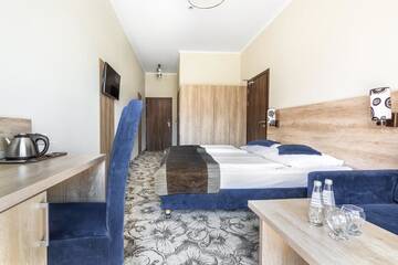 Фото номера Трехместный номер с балконом Отель RentPlanet - Hotel Nosal г. Закопане 7