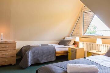 Фото номера Четырехместный номер - Мансарда Отели типа «постель и завтрак» Liberta INN - Pokoje Gościnne г. Закопане 10