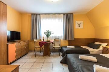 Фото номера Трехместный номер Отели типа «постель и завтрак» Liberta INN - Pokoje Gościnne г. Закопане 7