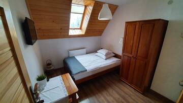 Фото номера Двухместный номер с 1 кроватью, вид на сад Проживание в семье Pokoje Widokowe Szymaszkowa г. Закопане 3
