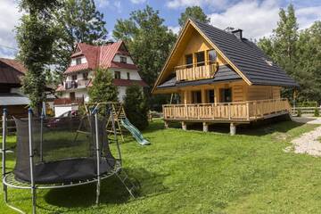 Фото номера Шале с двумя спальнями Дома для отпуска Domek Babcynówka г. Закопане 16