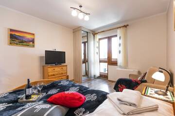 Фото номера Апартаменты с террасой Апартаменты Apartamenty Zakopane Krupówki г. Закопане 2