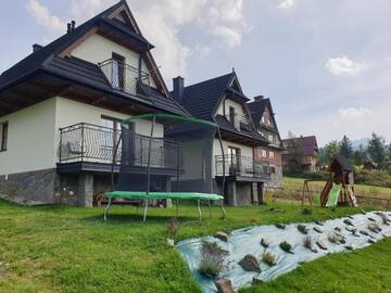 Фото номера Дом с 2 спальнями Дома для отпуска Domki U MAJERCZYKA г. Закопане 26